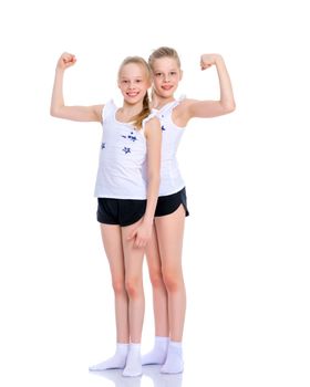 Jolly girls gymnasts are engaged in fitness, They show their muscles. Concept of children's sport, Happy people. Isolated on white background.