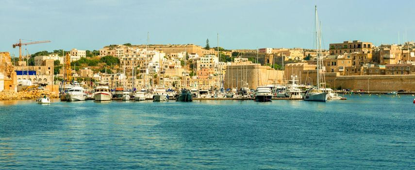 beautiful panorama of Valletta bay with boats and yachts near the pier, Malta