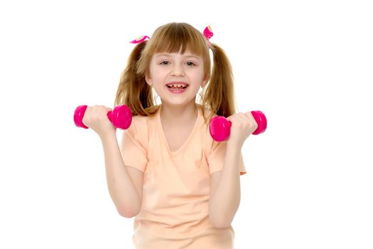 A cute little girl doing exercises with dumbbells. The concept of strength, health and sport. Isolated on white background.