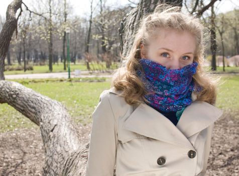 young pretty blonde girl enjoing spring nature in park, lifestyle people concept close up