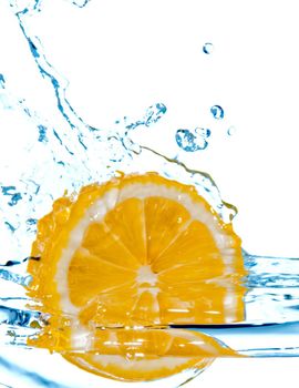 photo of the lemon slice fall in water with splash isolated on white