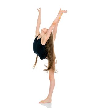 A girl gymnast balances on one leg.The concept of childhood, sport, a healthy lifestyle. Isolated on white background.