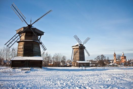 photo two windmills and church in Suzdal, Russia