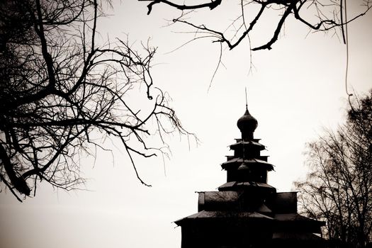 old wooden church int the scary winter forest