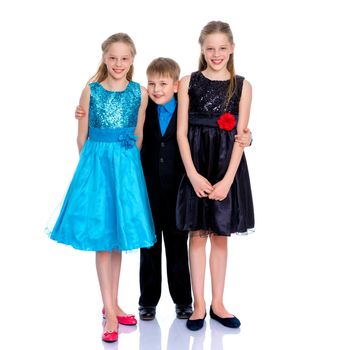 Group of happy little children posing in studio. The concept of a happy childhood, friendship.