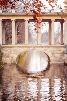 Bridge connecting east bank with Palace on the Water in the Royal Baths Park in Warsaw, Poland