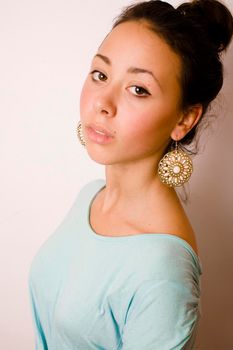 young brunette woman dressed like ancient greek godess, gold jewelry close up isolated close up