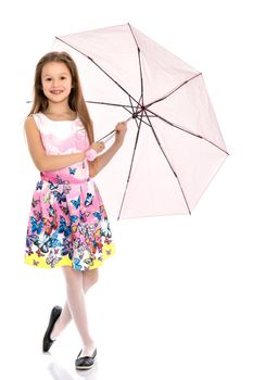 Beautiful teenage girl, in a summer dress under an umbrella. The concept of a happy childhood, summer outdoor recreation. Isolated on white background.