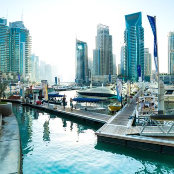 DUBAI, UAE - DECEMBER 14: Modern buildings in Dubai Marina, Dubai, UAE. In the city of artificial channel length of 3 kilometers along the Persian Gulf, taken on 13 December 2013 in Dubai.