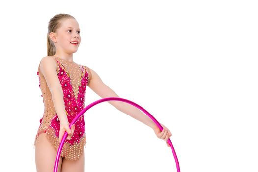 A girl gymnast performs an exercise with a hoop. The concept of gymnastics and fitness. Isolated on white background.