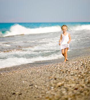 pretty little girl on tropical beach vacation