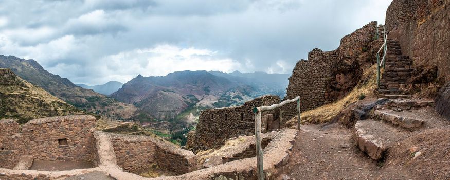 Old ruins of ancient abandoned citadel of Inkas on the mountain, Pisac, Peru, panorama