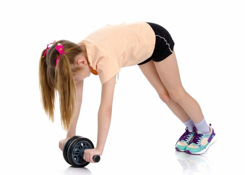 A nice little girl is performing gymnastic exercises. Concept of a healthy lifestyle, sport and fitness. Isolated on white background.