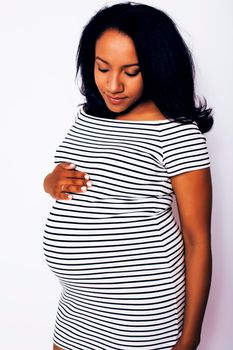 young pretty african american woman pregnant happy smiling, posing on white background isolated , lifestyle people concept copyspace close up