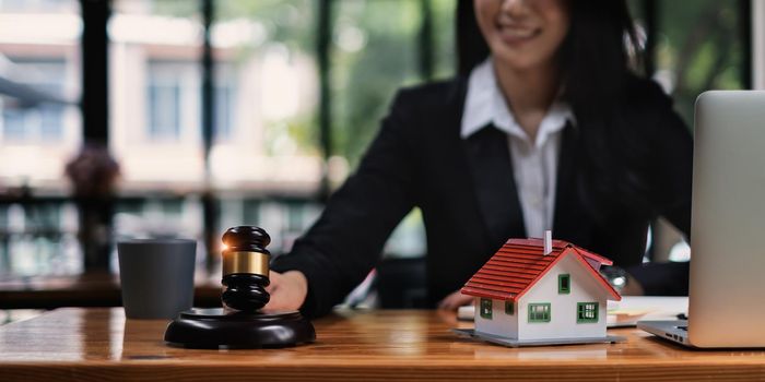 Business woman or lawyers discussing contract papers on wooden desk in office. Law, legal services, advice,Judge auction and real estate concept