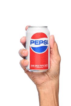 IRVINE, CALIFORNIA - APRIL 26, 2019: Closeup of a hand holding a cold can of Pepsi Cola. 