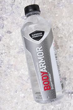 IRVINE, CALIFORNIA - JANUARY 5, 2018: BodyArmor Super Water on ice. The sports drink has Electrolytes, High performance pH in a Wide-mouth bottle. 