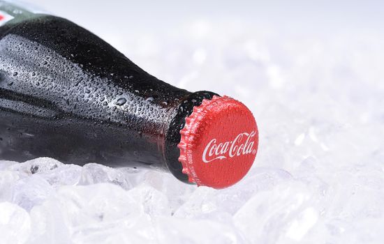 IRVINE, CALIFORNIA - FEBRUARY 7, 2017: Coca-Cola Bottle on ice. Introduced in 1886, the Atlanta based soft drink manufacturers products are available in 200 countries.