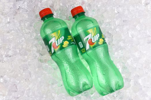 IRVINE, CALIFORNIA - AUGUST 19, 2019: Two plastic 7-up lemon-lime soda bottles in ice.