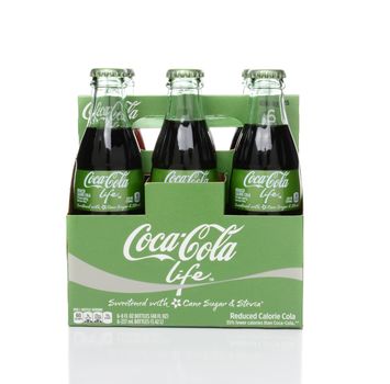 IRVINE, CA - FEBRUARY 15, 2015: 6 pack bottles of Coca-Cola Life side view. A reduced calorie soft drink sweetened with cane sugar and Stevia, containing 60% of the calories of Classic Coke.