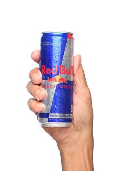 IRVINE, CALIFORNIA - APRIL 26, 2019: Closeup of a hand holding a can of Red Bull Energy Drink. Red Bull is the most popular energy drink in the world.