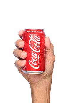IRVINE, CALIFORNIA - APRIL 26, 2019: Closeup of a hand holding a cold can of  Coca-Cola. 