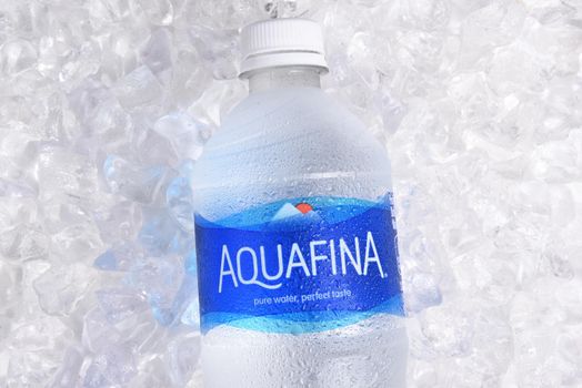 IRVINE, CALIFORNIA - JANUARY 22, 2017: Aquafina Water Bottle on ice. The purified water brand is produced by PepsiCo, in both flavored and unflavored varieties.