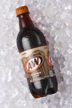 IRVINE, CALIFORNIA - 26 JUNE 2021: A and W Root Beer bottle on ice. Owned by Dr Pepper Snapple Group and distributed by the Coca-Cola Company in the USA.