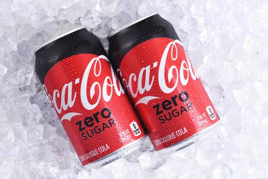 IRVINE, CALIFORNIA - MAY 23, 2018: Two cans of Coca-Cola Zero Sugar on ice. The drink replaced an earlier version, known as Coca-Cola Zero and Coke Zero, which was also a no-calorie cola.