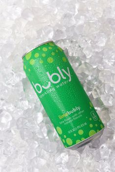 IRVINE, CALIFORNIA - 10 APRIL 2020: A can of Bubly Lime Sparkling Water in a bed of ice. 