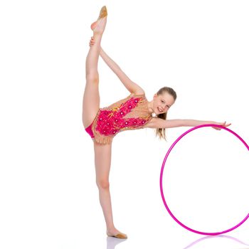 A girl gymnast performs an exercise with a hoop. The concept of gymnastics and fitness. Isolated on white background.