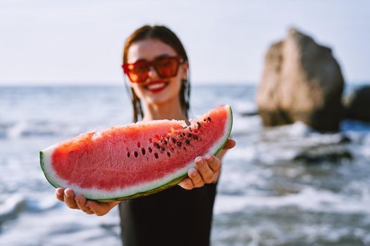 cheerful pretty woman in black swimsuit watermelon fashion travel. High quality photo