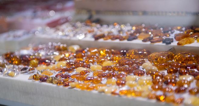 Colorful pieces of amber in a tourist souvenir store in Warsaw, Poland