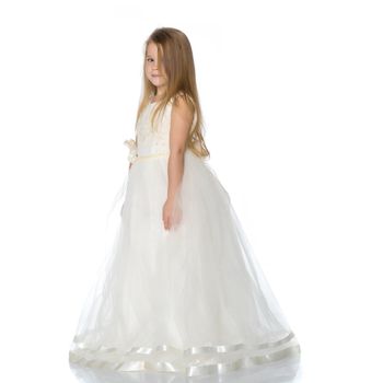 Charming little princess in a long dress. The concept of a happy childhood, beauty and fashion. Isolated on white background.