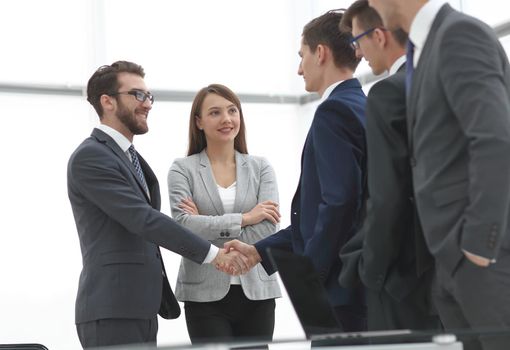 business partners shaking hands on meeting