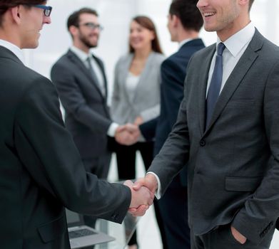 handshake of business partners after the briefing.