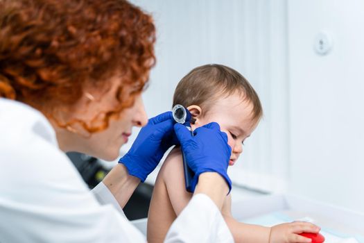 Little girl at doctor for checkup. Doctor pediatrician and baby patient. Child patient at doctor appointment. Pediatrician checking kid's health. Medical examination by a neonotologist doctor of baby.