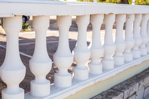 Exterior, design and building concept - Row of classic white balcony columns.