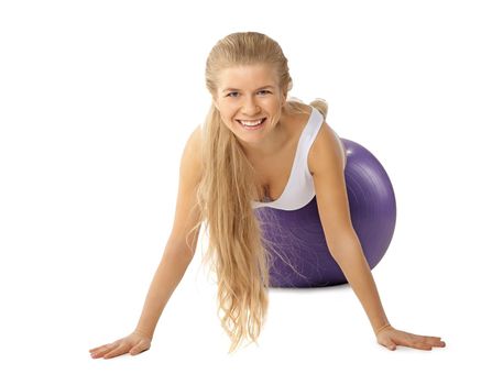 Young happy woman doing exercises with fitball isolated over white background