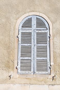 Old window shutters of an mediterranean house, vintage background