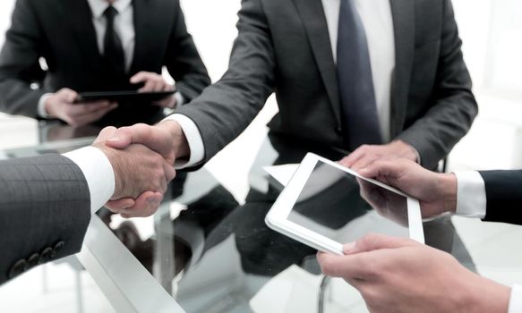 close up. business people handshake over the Desk.