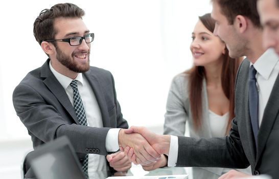 handshake of trading partners at the Desk.