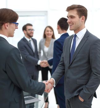 handshake of business partners after the briefing.