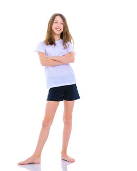 A little girl gymnast joyfully jumps and wags her hands. The concept of sport and fitness. Isolated over white background