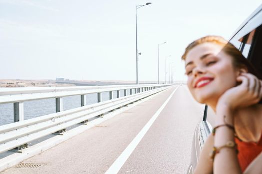 cheerful woman car ride road travel adventure. High quality photo
