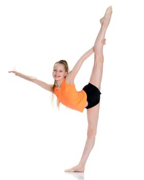 A little girl gymnast performs an exercise: Balance with a grip in the ring. The concept of sport, gymnastics, fitness training, sports development of the child. Isolated on white background.