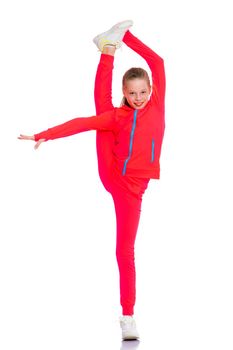 A girl gymnast balances on one leg.The concept of childhood, sport, a healthy lifestyle. Isolated on white background.