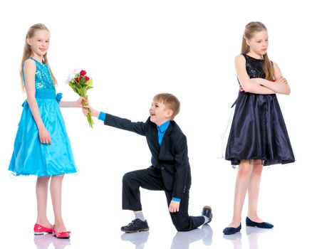 A little boy gives a little girl flowers. The concept of a happy childhood, love. Isolated on white background.