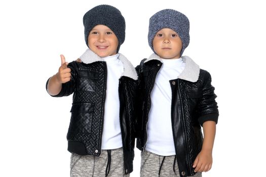 Studio portrait of boys in black leather jackets.Isolated on white background.