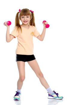 A nice little girl is performing gymnastic exercises. Concept of a healthy lifestyle, sport and fitness. Isolated on white background.